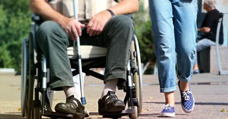 Disabled person in a wheelchair.